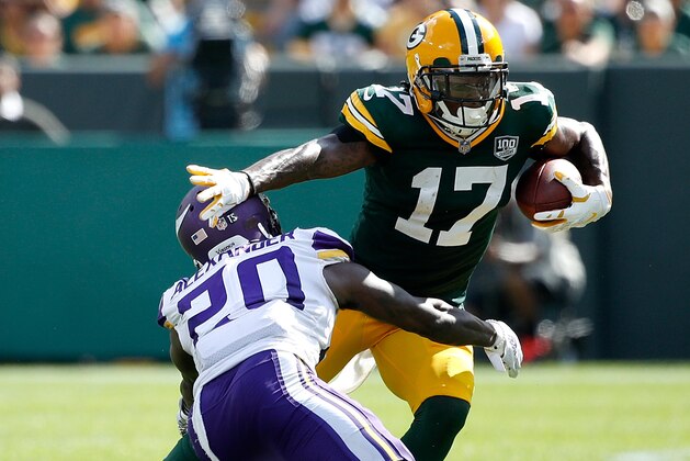 GREEN BAY, WI - SEPTEMBER 16:  Davante Adams #17 of the Green Bay Packers is tackled by Mackensie Alexander #20 of the Minnesota Vikings after making a catch in the fourth quarter of a game at Lambeau Field on September 16, 2018 in Green Bay, Wisconsin.  (Photo by Joe Robbins/Getty Images)