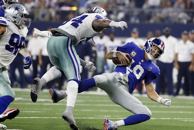 New York Giants quarterback Eli Manning (10) falls after taking a hit from Dallas Cowboys linebacker Jaylon Smith (54) during the second half of an NFL football game in Arlington, Texas, Sunday, Sept. 16, 2018. (AP Photo/Michael Ainsworth)