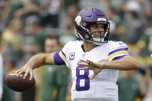 Minnesota Vikings' Kirk Cousins warms up before an NFL football game against the Green Bay Packers Sunday, Sept. 16, 2018, in Green Bay, Wis. (AP Photo/Jeffrey Phelps)