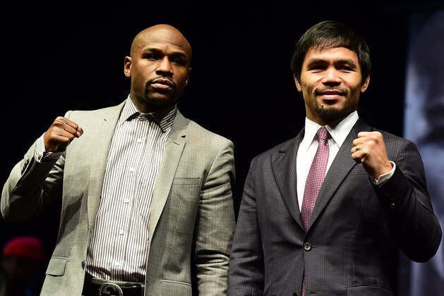 Boxers Manny Pacquiao (R) from the Philippines and Floyd Mayweather from the US pose during a press conference on March 11, 2015 in Los Angeles, California, to launch the countdown to their May 2, 2015 super-fight in Las Vegas. AFP PHOTO/ FREDERIC J. BROWN        (Photo credit should read FREDERIC J. BROWN/AFP/Getty Images)