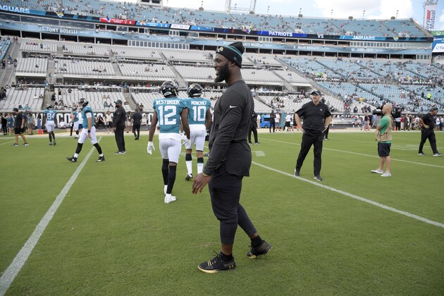Jacksonville Jaguars running back Leonard Fournette watches warmups before an NFL football game against the New England Patriots Sunday, Sept. 16, 2018, in Jacksonville, Fla. (AP Photo/Phelan M. Ebenhack)
