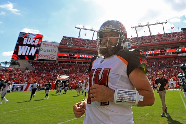 TAMPA, FL - SEPTEMBER 16:  Ryan Fitzpatrick #14 of the Tampa Bay Buccaneers walks off the field after winning a game against the Philadelphia Eagles at Raymond James Stadium on September 16, 2018 in Tampa, Florida.  (Photo by Mike Ehrmann/Getty Images)