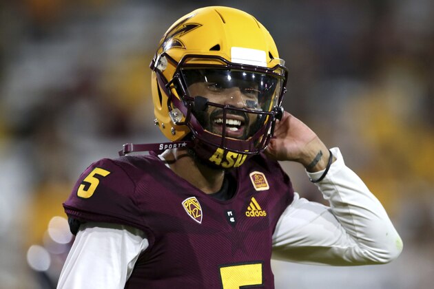 Arizona State quarterback Manny Wilkins (5) walks off the field after a touchdown against UTSA during the second half of an NCAA college football game, Saturday, Sept. 1, 2018, in Tempe, Ariz. (AP Photo/Ralph Freso)