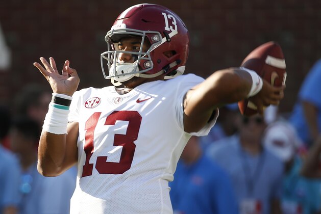 Alabama quarterback Tua Tagovailoa (13) passes the football during the pregame warmups of their NCAA college football game against Mississippi on Saturday, Sept. 15, 2018, in Oxford, Miss. (AP Photo/Rogelio V. Solis)