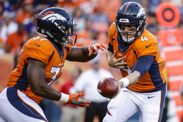 Denver Broncos quarterback Case Keenum hands off to running back Royce Freeman (37) against the Minnesota Vikings during the first half in an NFL football game Saturday, Aug. 11, 2018, in Denver. (AP Photo/Jack Dempsey)