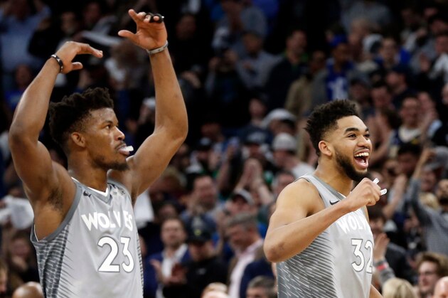 FILE - In this April 11, 2018, file photo, Minnesota Timberwolves' Jimmy Butler, left, Karl-Anthony Towns celebrate in the final seconds as the Timberwolves defeated the Denver Nuggets 112-106 in overtime in an NBA basketball game in Minneapolis. The Timberwolves are in a tricky situation this summer, with needs for more depth, defense and 3-point shooting but no clear-cut ways to acquire any of it. They've got contracts to address with their two All-Stars, too, in Karl-Anthony Towns and Jimmy Butler. (AP Photo/Jim Mone, File)