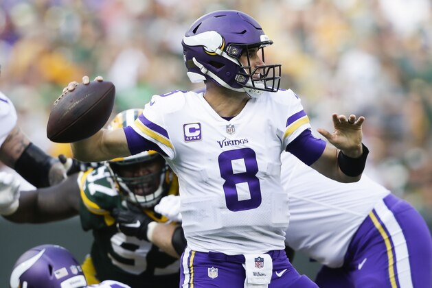 Minnesota Vikings' Kirk Cousins throws during the second half of an NFL football game against the Green Bay Packers Sunday, Sept. 16, 2018, in Green Bay, Wis. (AP Photo/Jeffrey Phelps)
