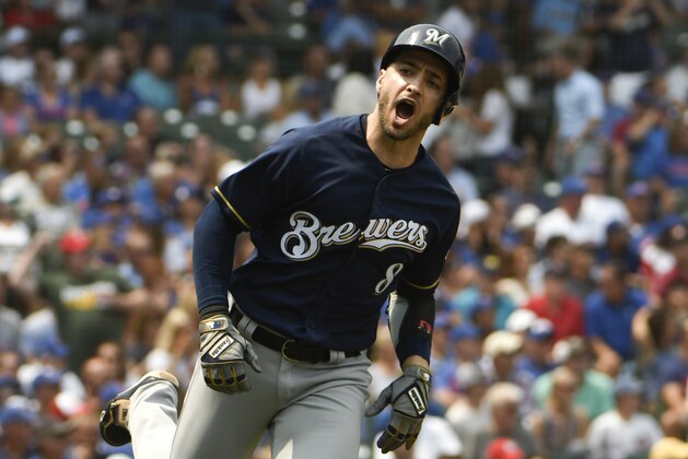 Milwaukee Brewers' Ryan Braun (8) reacts after hitting a two-run home run against the Chicago Cubs during the first inning of a baseball game,Tuesday, Aug. 14, 2018, in Chicago. (AP Photo/David Banks)