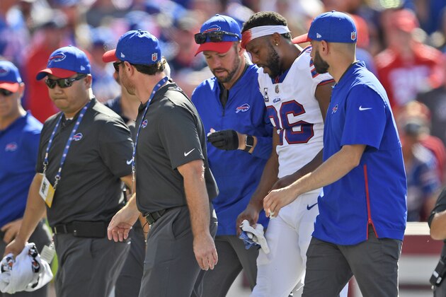 Buffalo Bills' Taiwan Jones, second from right, is helped off the field during the second half of an NFL football game against the Los Angeles Chargers, Sunday, Sept. 16, 2018, in Orchard Park, N.Y. (AP Photo/Adrian Kraus)