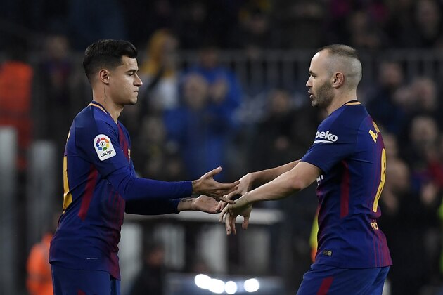 Barcelona's Brazilian midfielder Philippe Coutinho (L) replaces Barcelona's Spanish midfielder Andres Iniesta during the Spanish 'Copa del Rey' (King's cup) quarter-final second leg football match between FC Barcelona and RCD Espanyol at the Camp Nou stadium in Barcelona on January 25, 2018.  / AFP PHOTO / LLUIS GENE        (Photo credit should read LLUIS GENE/AFP/Getty Images)