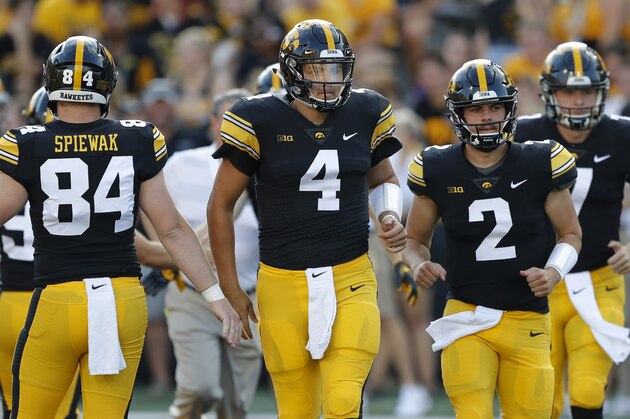 Iowa quarterback Nate Stanley (4) and quarterback Peyton Mansell (2) run onto the field before an NCAA college football game against Northern Iowa, Saturday, Sept. 15, 2018, in Iowa City, Iowa. (AP Photo/Charlie Neibergall)