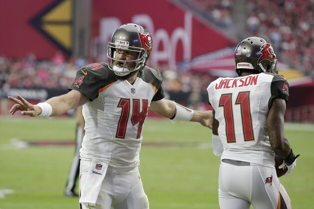 Tampa Bay Buccaneers quarterback Ryan Fitzpatrick (14) celebrates with wide receiver DeSean Jackson (11) after Jackson's touchdown against the Arizona Cardinals during the second half of an NFL football game Sunday, Oct. 15, 2017, in Glendale, Ariz. (AP Photo/Rick Scuteri)