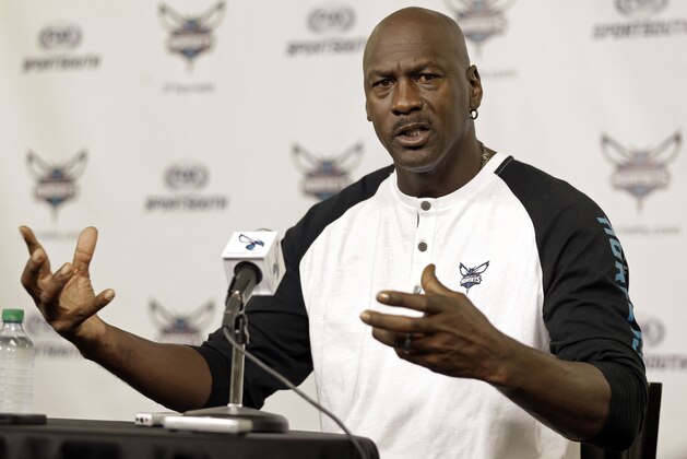 Charlotte Hornets owner Michael Jordan answers a question from the media during a news conference about the NBA basketball team in Charlotte, N.C., Tuesday, Oct. 28, 2014. (AP Photo/Chuck Burton)