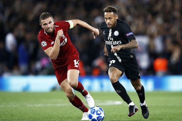 LIVERPOOL, ENGLAND - SEPTEMBER 18:  Neymar of Paris Saint-Germain runs with the ball under pressure from Jordan Henderson of Liverpool during the Group C match of the UEFA Champions League between Liverpool and Paris Saint-Germain at Anfield on September 18, 2018 in Liverpool, United Kingdom.  (Photo by Julian Finney/Getty Images)