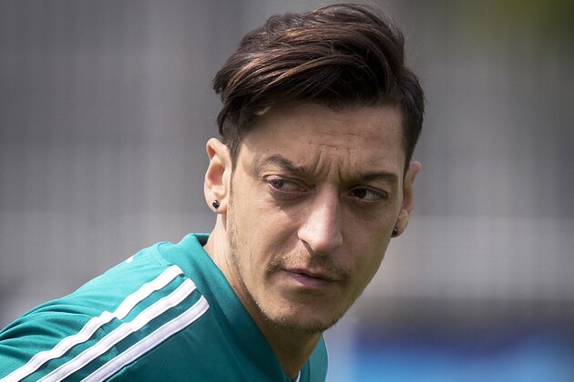 FILE-In this June 14 file photo Mesut Oezil looks around during a training session of the German team at the 2018 soccer World Cup in Vatutinki near Moscow, Russia, Thursday, June 14, 2018. (AP Photo/Michael Probst,file)