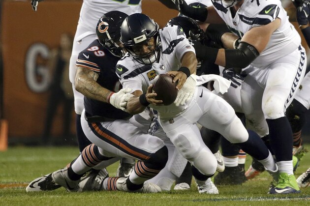 Chicago Bears linebacker Aaron Lynch (99) sacks Seattle Seahawks quarterback Russell Wilson (3) during the first half of an NFL football game Monday, Sept. 17, 2018, in Chicago. (AP Photo/David Banks)