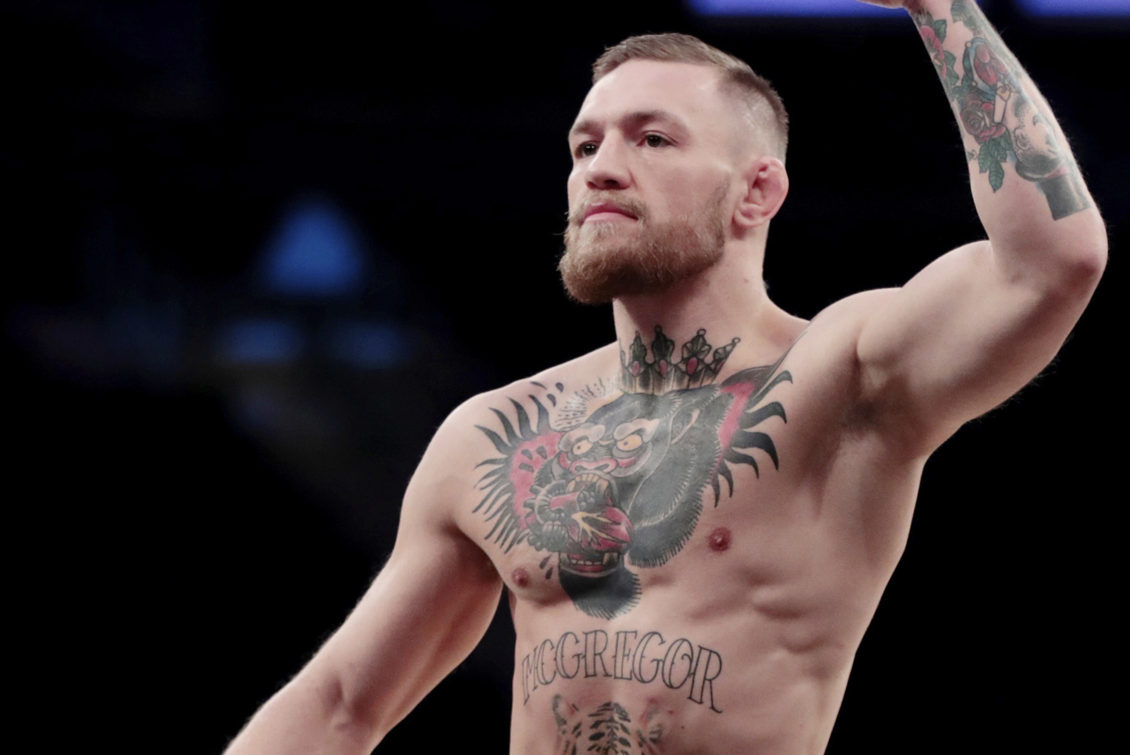 FILE - In this Nov. 9, 2016, file photo, Conor McGregor gestures toward fans while working out at Madison Square Garden in New York. Boxer Floyd Mayweather Jr. said Wednesday, June 14, 2017,  he will come out of retirement to face UFC star Conor McGregor in a boxing match on Aug. 26. Mayweather, who retired in September 2015 after winning all 49 of his pro fights, will face a mixed martial arts fighter who has never been in a scheduled 12-round fight at the MGM Grand arena. The fight will take place in a boxing ring and be governed by boxing rules. (AP Photo/Julio Cortez, File)