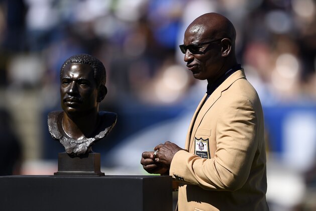 Former member of the Los Angeles Rams Eric Dickerson looks as his bust after receiving his ring during the Rams Hall of Fame Ring of Excellence ceremony at halftime of an NFL football game between the Rams and the Seattle Seahawks at the Los Angeles Memorial Coliseum, Sunday, Sept. 18, 2016, in Los Angeles. (AP Photo/Kelvin Kuo) Former member of the Los Angeles Rams Eric Dickerson looks as his bust after receiving his ring during the Rams Hall of Fame Ring of Excellence ceremony at halftime of an NFL football game between the Rams and the Seattle Seahawks at the Los Angeles Memorial Coliseum, Sunday, Sept. 18, 2016, in Los Angeles. (AP Photo/Kelvin Kuo)