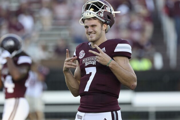 Mississippi State quarterback Nick Fitzgerald (7) makes some hand gestures during pregame drills before their NCAA college football game against Louisiana-Lafayette on Saturday, Sept. 15, 2018, in Starkville, Miss. (AP Photo/Jim Lytle)