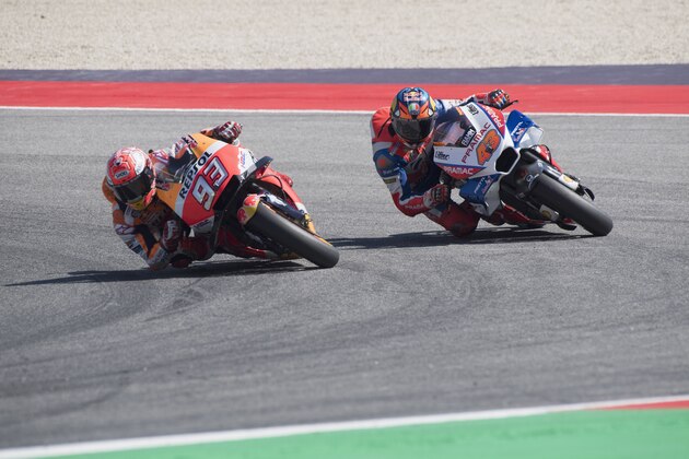 MISANO ADRIATICO, ITALY - SEPTEMBER 09:  Marc Marquez of Spain and Repsol Honda Team and  Jack Miller of Australia and Alma Pramac Racing (R) round the bend  during the MotoGP race during the MotoGP of San Marino - Race at Misano World Circuit on September 9, 2018 in Misano Adriatico, Italy.  (Photo by Mirco Lazzari gp/Getty Images)