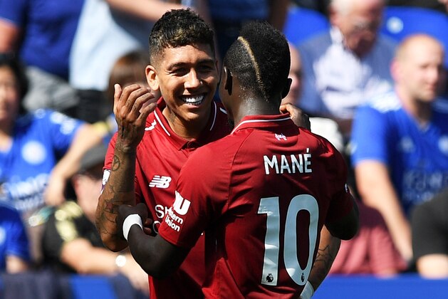 LEICESTER, ENGLAND - SEPTEMBER 01:  Roberto Firmino of Liverpool celebrates after scoring his team's second goal with Sadio Mane during the Premier League match between Leicester City and Liverpool FC at The King Power Stadium on September 1, 2018 in Leicester, United Kingdom.  (Photo by Shaun Botterill/Getty Images)