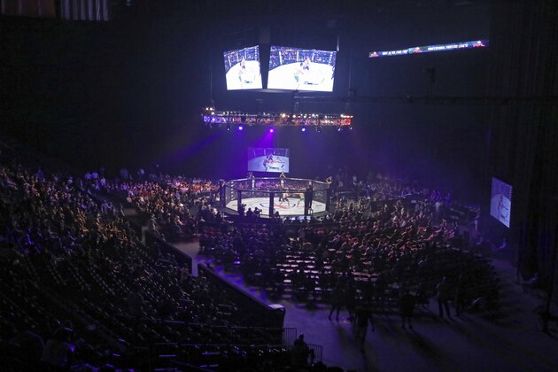 The cage and crowd are scene in an overall view at PFL 4, Thursday, July 19, 2018, at Nassau Coliseum in New York. Harrison won via unanimous decision. (AP Photo/Gregory Payan)