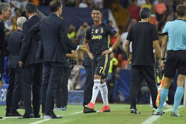 Juventus' Portuguese forward Cristiano Ronaldo (C) cries after receiving a red card during the UEFA Champions League group H football match between Valencia CF and Juventus FC at the Mestalla stadium in Valencia on September 19, 2018. (Photo by JOSE JORDAN / AFP)        (Photo credit should read JOSE JORDAN/AFP/Getty Images)