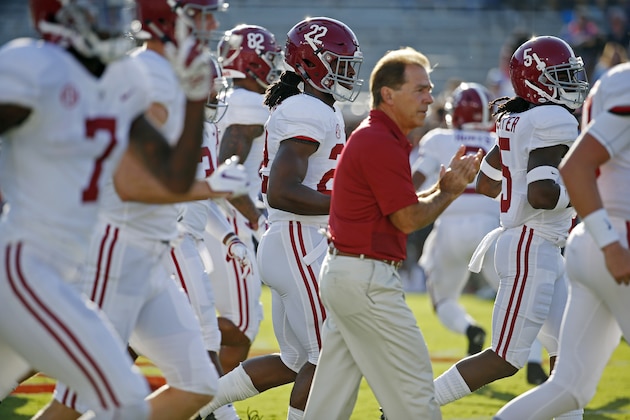 Alabama head coach Nick Saban jogs from the dressing room with his players during warmups prior to the NCAA college football game against Mississippi on Saturday, Sept. 15, 2018, in Oxford, Miss. Alabama won 62-7. (AP Photo/Rogelio V. Solis)