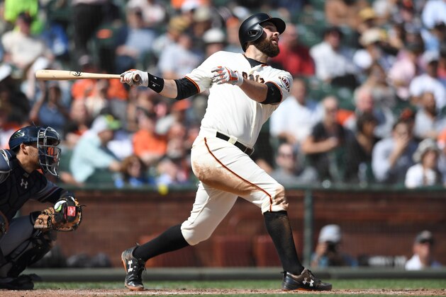 SAN FRANCISCO, CA - SEPTEMBER 12:  Brandon Belt #9 of the San Francisco Giants bats against the Atlanta Braves in the bottom of the fifth inning at AT&T Park on September 12, 2018 in San Francisco, California.  (Photo by Thearon W. Henderson/Getty Images)