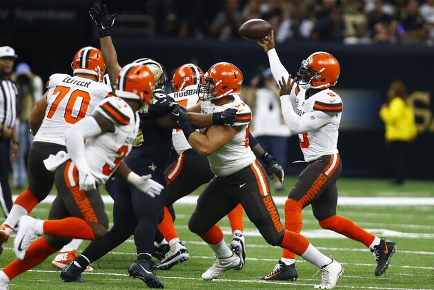 Cleveland Browns quarterback Tyrod Taylor, right, passes during the second half of an NFL football game against the New Orleans Saints in New Orleans, Sunday, Sept. 16, 2018. (AP Photo/Butch Dill)