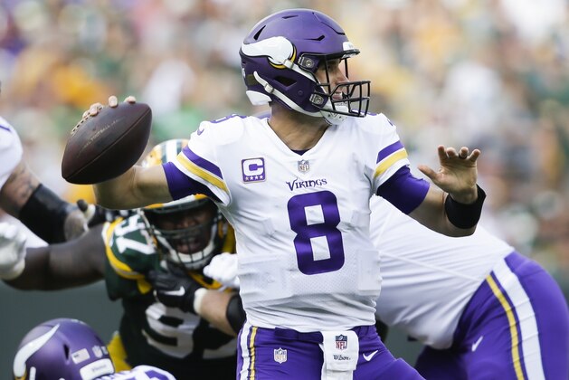 Minnesota Vikings' Kirk Cousins throws during the second half of an NFL football game against the Green Bay Packers Sunday, Sept. 16, 2018, in Green Bay, Wis. (AP Photo/Jeffrey Phelps)