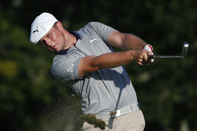 Bryson DeChambeau tees off on the 17th hole during the final round of the Dell Technologies Championship golf tournament at TPC Boston in Norton, Mass., Monday, Sept. 3, 2018. (AP Photo/Michael Dwyer)