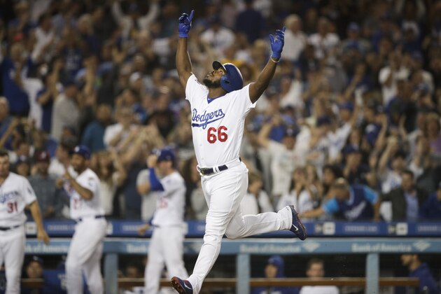 Los Angeles Dodgers' Yasiel Puig celebrates his three-run home run during the seventh inning against the Colorado Rockies in a baseball game Wednesday, Sept. 19, 2018, in Los Angeles. (AP Photo/Jae C. Hong)