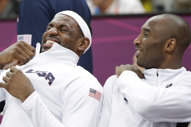 USA's Lebron James, left, and Kobe Bryant, right, share a laugh on the bench during a preliminary men's basketball game against Nigeria at the 2012 Summer Olympics, Thursday, Aug. 2, 2012, in London. (AP Photo/Eric Gay)