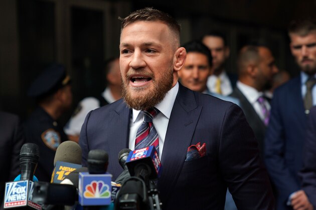 Irish mixed martial arts superstar Conor McGregor talks to the press after he pleaded guilty to a single violation of disorderly conduct, in Brooklyn Criminal Court on July 26, 2018. - The 30-year-old, who is nicknamed 'The Notorious,' had been charged with multiple counts of assault and criminal mischief after attacking a bus filled with UFC fighters at the Barclays Center. He pleaded guilty to a lesser charge of disorderly conduct in a fleeting court appearance, and was handed a punishment of five days' community service. (Photo by TIMOTHY A. CLARY / AFP)        (Photo credit should read TIMOTHY A. CLARY/AFP/Getty Images)