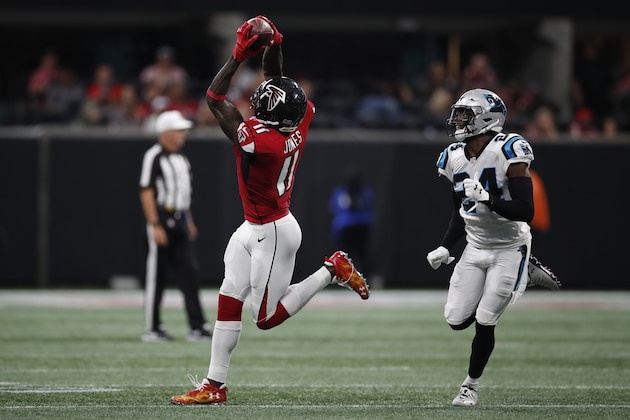 Atlanta Falcons wide receiver Julio Jones (11) makes a catch in front of Carolina Panthers cornerback James Bradberry (24) during an NFL football game, Sunday, Sept. 16, 2018, in Atlanta. (Jeff Haynes/AP Images for Panini)