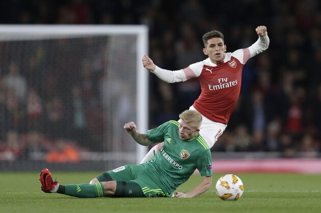 LONDON, ENGLAND - SEPTEMBER 20: Lucas Torreira of Arsenal is fouled by Vladyslav Kulach of Vorskla Poltava during the UEFA Europa League Group E match between Arsenal and Vorskla Poltava at Emirates Stadium on September 20, 2018 in London, United Kingdom.  (Photo by Henry Browne/Getty Images)