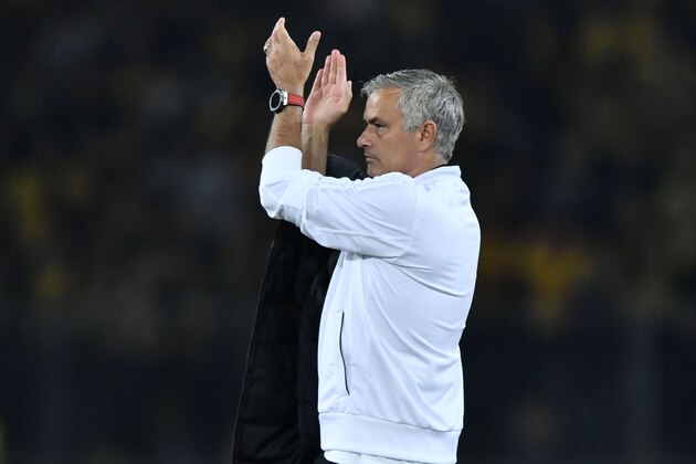 TOPSHOT - Manchester United's Portuguese manager Jose Mourinho applauds supporters after the UEFA Champions League group H football match between Young Boys and Manchester United at The Stade de Suisse in Bern on September 19, 2018. (Photo by Fabrice COFFRINI / AFP)        (Photo credit should read FABRICE COFFRINI/AFP/Getty Images)