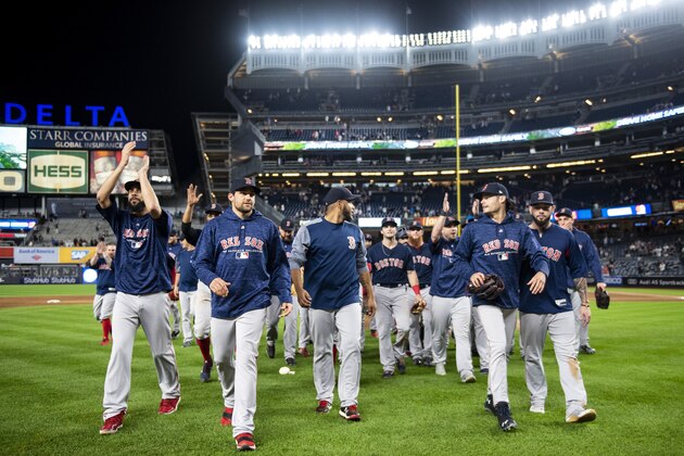 NEW YORK, NY - SEPTEMBER 20: Members of the Boston Red Sox celebrate as they clinch the American League East division after a victory against the New York Yankees on September 20, 2018 at Yankee Stadium in the Bronx borough of New York City. (Photo by Billie Weiss/Boston Red Sox/Getty Images)