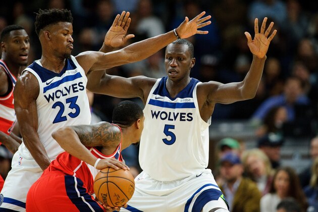MINNEAPOLIS, MN - NOVEMBER 28: Jimmy Butler #23 and Gorgui Dieng #5 of the Minnesota Timberwolves defend against Bradley Beal #3 of the Washington Wizards during the game on November 28, 2017 at the Target Center in Minneapolis, Minnesota. NOTE TO USER: User expressly acknowledges and agrees that, by downloading and or using this Photograph, user is consenting to the terms and conditions of the Getty Images License Agreement. (Photo by Hannah Foslien/Getty Images)