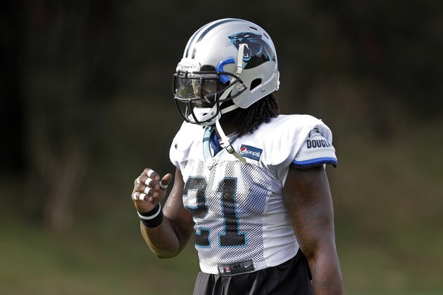 Carolina Panthers' Da'Norris Searcy (21) arrives before an NFL football practice at the team's training camp in Spartanburg, S.C., Monday, July 30, 2018. (AP Photo/Chuck Burton)