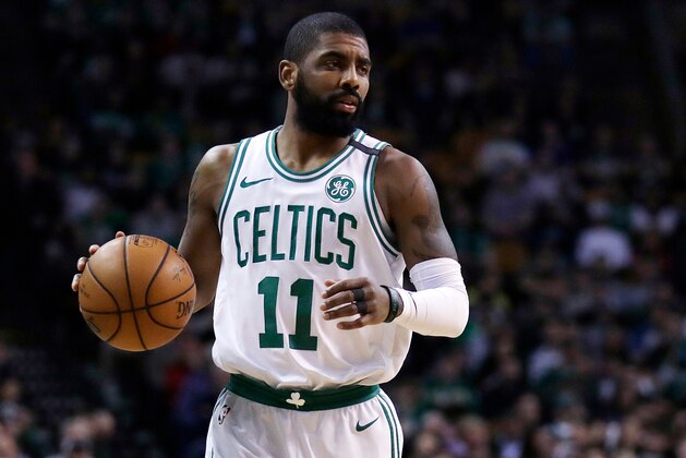 FILE - In this Feb. 28, 2018, file photo, Boston Celtics guard Kyrie Irving (11) moves down court during the first quarter of an NBA basketball game in Boston. A person with knowledge of the situation says Celtics point guard Kyrie Irving will miss the rest of the regular season and playoffs after surgery on his left knee. The official spoke on the condition of anonymity to The Associated Press because the team has not released the news. (AP Photo/Charles Krupa)