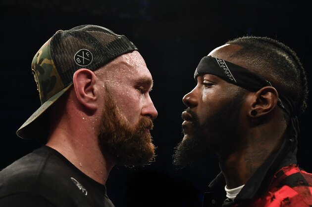 BELFAST, NORTHERN IRELAND - AUGUST 18: Tyson Fury is confronted by rival boxer Deontay Wilder after defeating Francesco Pianeta in a heavyweight contest at Windsor Park on August 18, 2018 in Belfast, Northern Ireland. (Photo by Charles McQuillan/Getty Images)