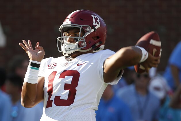 Alabama quarterback Tua Tagovailoa (13) passes the football during the pregame warmups of their NCAA college football game against Mississippi on Saturday, Sept. 15, 2018, in Oxford, Miss. (AP Photo/Rogelio V. Solis)