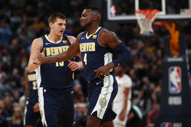 Denver Nuggets forward Paul Millsap (4) and Denver Nuggets center Nikola Jokic (15) in the first half of an NBA basketball game Friday, Nov. 17, 2017, in Denver. (AP Photo/David Zalubowski)