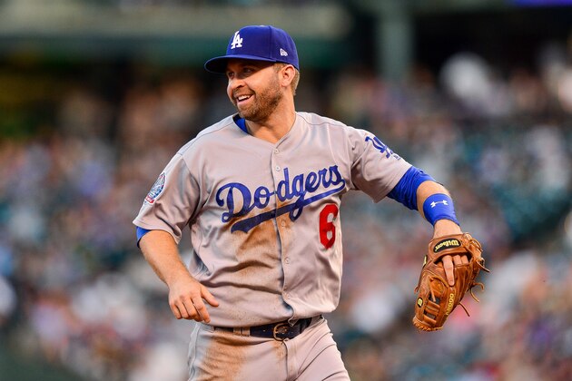 DENVER, CO - SEPTEMBER 8:  Brian Dozier #6 of the Los Angeles Dodgers smiles as he runs off the field during a game against the Colorado Rockies at Coors Field on September 8, 2018 in Denver, Colorado.  (Photo by Dustin Bradford/Getty Images)
