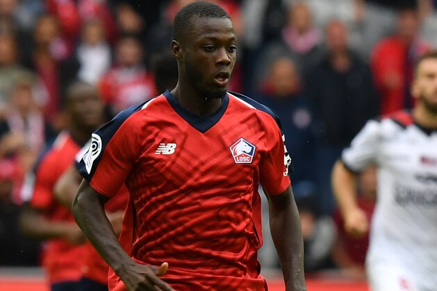 Lille's Ivorian forward Nicolas Pepe runs with the ball during the French L1 football match between Lille OSC (LOSC) and Guingamp at the Pierre-Mauroy Stadium in Villeneuve d'Ascq, near Lille, northern France, on August 26, 2018. (Photo by DENIS CHARLET / AFP)        (Photo credit should read DENIS CHARLET/AFP/Getty Images)