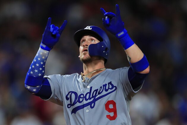 ARLINGTON, TX - AUGUST 29:  Yasmani Grandal #9 of the Los Angeles Dodgers celebrates after hitting a solo home run against the Texas Rangers in the top of the eighth inning at Globe Life Park in Arlington on August 29, 2018 in Arlington, Texas.  (Photo by Tom Pennington/Getty Images)