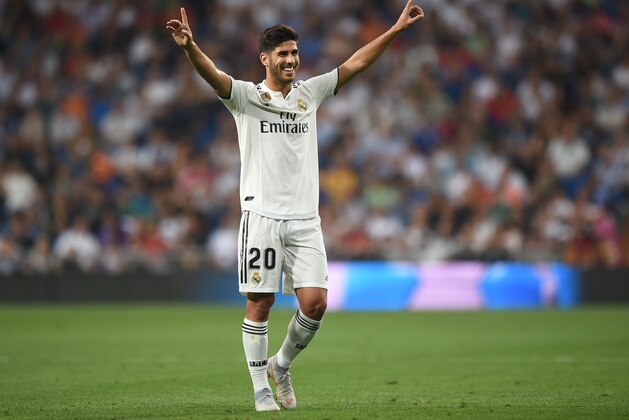 MADRID, SPAIN - SEPTEMBER 22:  Marco Asensio of Real Madrid celebrates after scoring his teams opening goal during the La Liga match between Real Madrid CF and RCD Espanyol at Estadio Santiago Bernabeu on September 22, 2018 in Madrid, Spain. (Photo by Denis Doyle/Getty Images,)