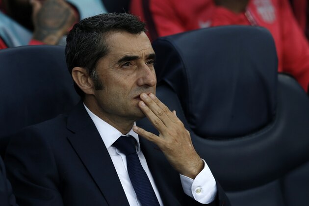 Barcelona coach Ernesto Valverde sits on the bench before the group B Champions League soccer match between FC Barcelona and PSV Eindhoven at the Camp Nou stadium in Barcelona, Spain, Tuesday, Sept. 18, 2018. (AP Photo/Manu Fernandez)